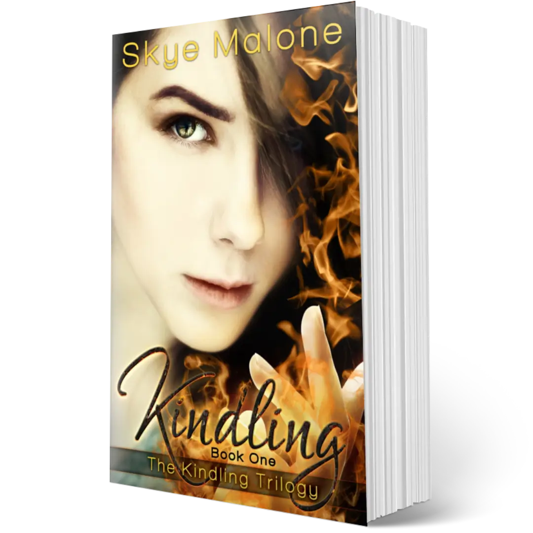 The paperback edition of Kindling by Skye Malone, book one of the Kindling trilogy. A girl with a serious expression and dark hair holds up one hand with fire coming from her fingers.